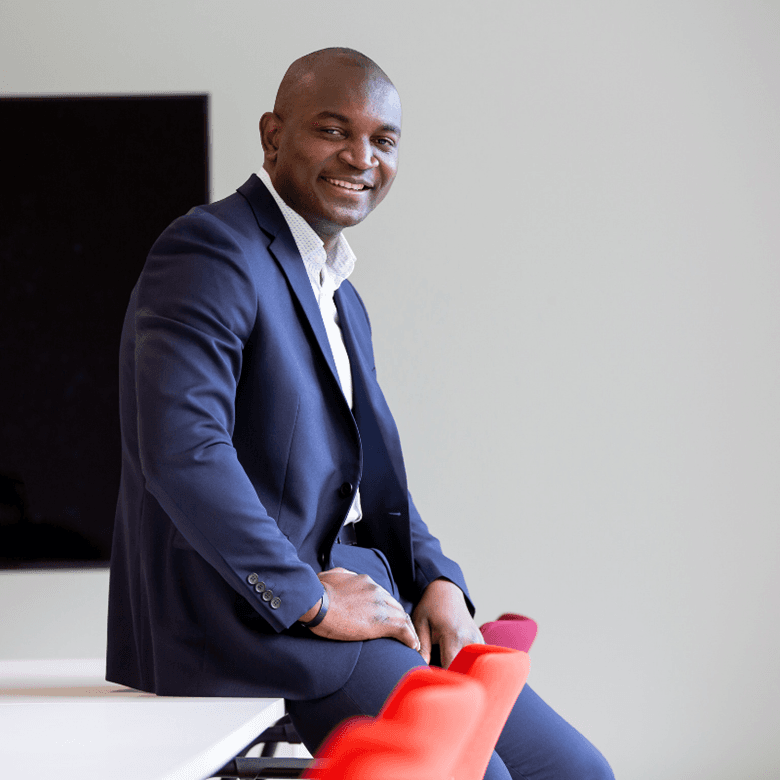 ©Studio Cabrelli Smiling Man In A Meeting Room Looking Straight Ahead